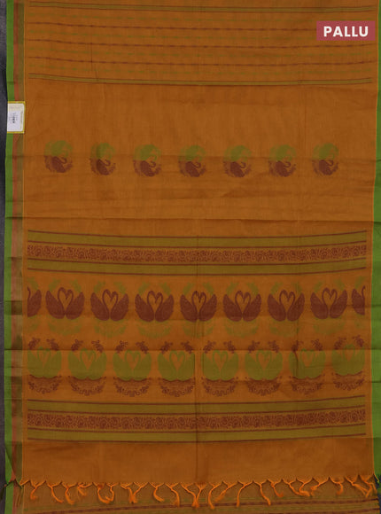 Nithyam cotton saree dark mustard and green with allover self emboss & thread woven buttas and simple border