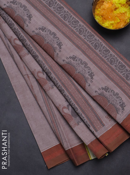 Nithyam cotton saree pastel brown shade and brown with allover self emboss & thread woven buttas and simple border