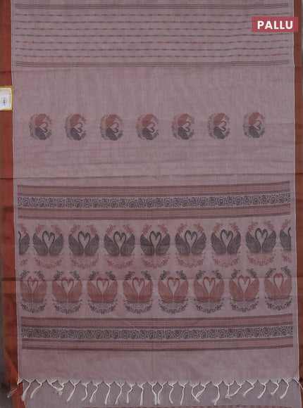 Nithyam cotton saree pastel brown shade and brown with allover self emboss & thread woven buttas and simple border