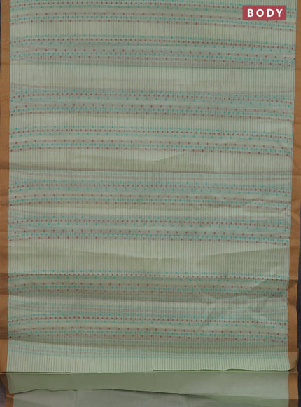 Nithyam cotton saree pista green and dark mustard with thread woven buttas and simple border