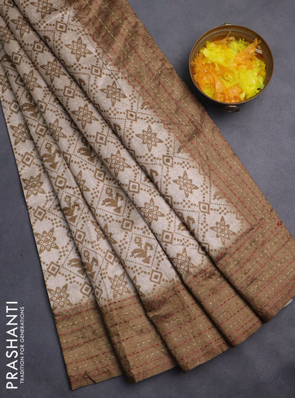 Semi tussar saree beige and mehendi green with allover prints and kantha stitch work border