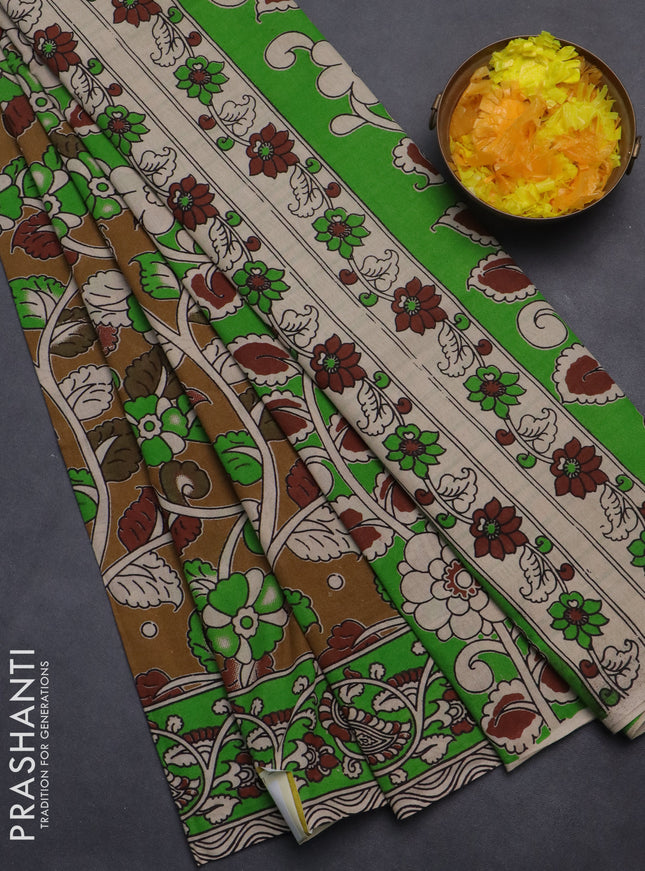 Kalamkari cotton saree dark mustard and green with allover prints and printed border