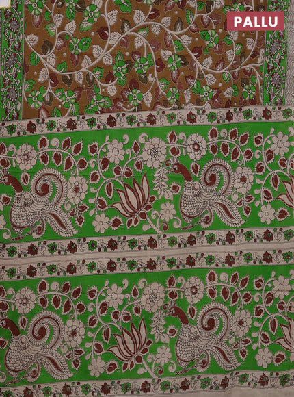 Kalamkari cotton saree dark mustard and green with allover prints and printed border