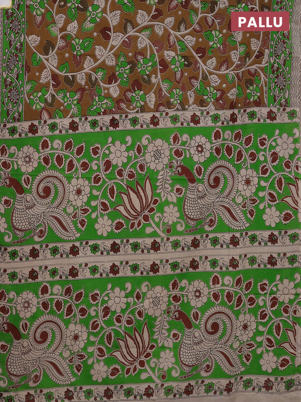 Kalamkari cotton saree dark mustard and green with allover prints and printed border