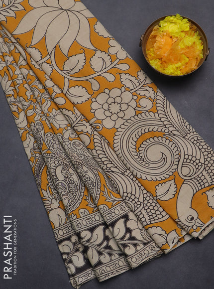 Kalamkari cotton saree yellow and black with allover prints and printed border
