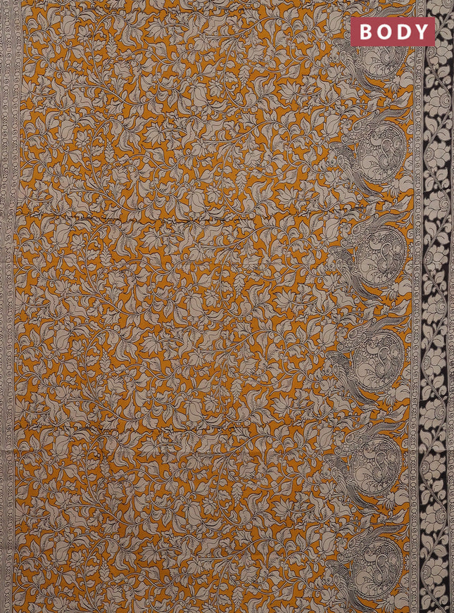 Kalamkari cotton saree yellow and black with allover prints and printed border