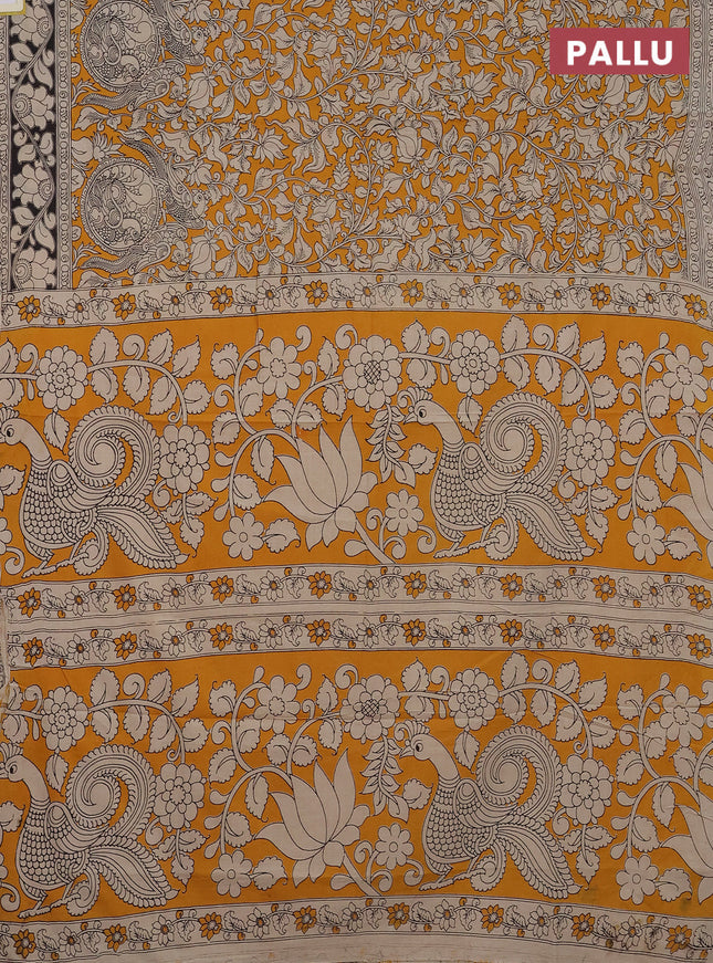 Kalamkari cotton saree yellow and black with allover prints and printed border