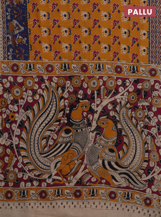 Kalamkari cotton saree mustard yellow and blue with allover ikat prints and printed border