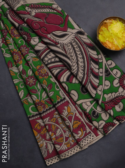 Kalamkari cotton saree light green and pink with allover prints and printed border