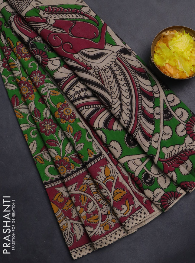 Kalamkari cotton saree light green and pink with allover prints and printed border