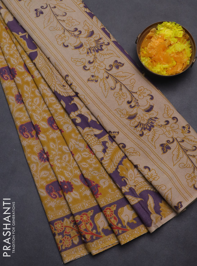 Kalamkari cotton saree mustard yellow and violet with allover prints and printed border