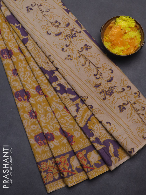 Kalamkari cotton saree mustard yellow and violet with allover prints and printed border