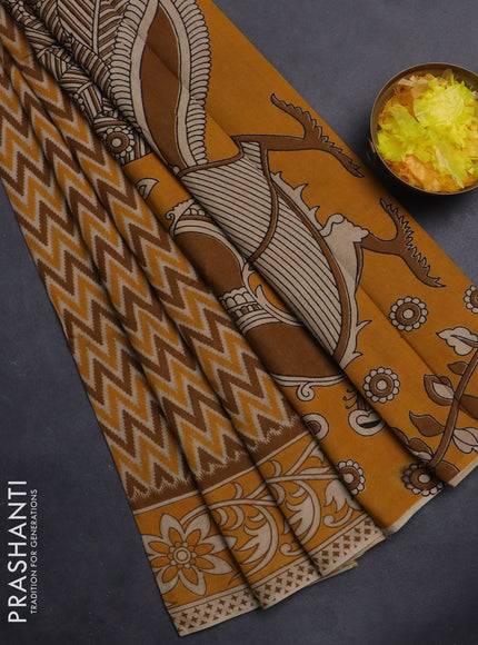 Kalamkari cotton saree dark mustard with allover zig zag prints and printed border