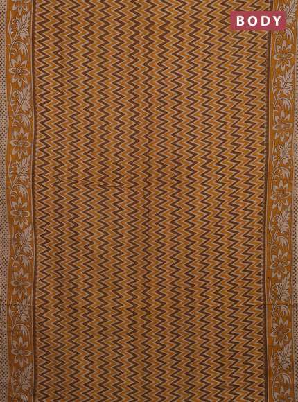 Kalamkari cotton saree dark mustard with allover zig zag prints and printed border