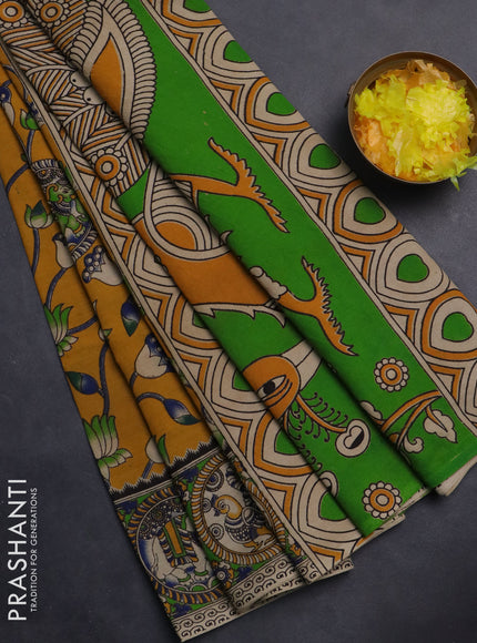 Kalamkari cotton saree mustard yellow and light green with allover prints and printed border