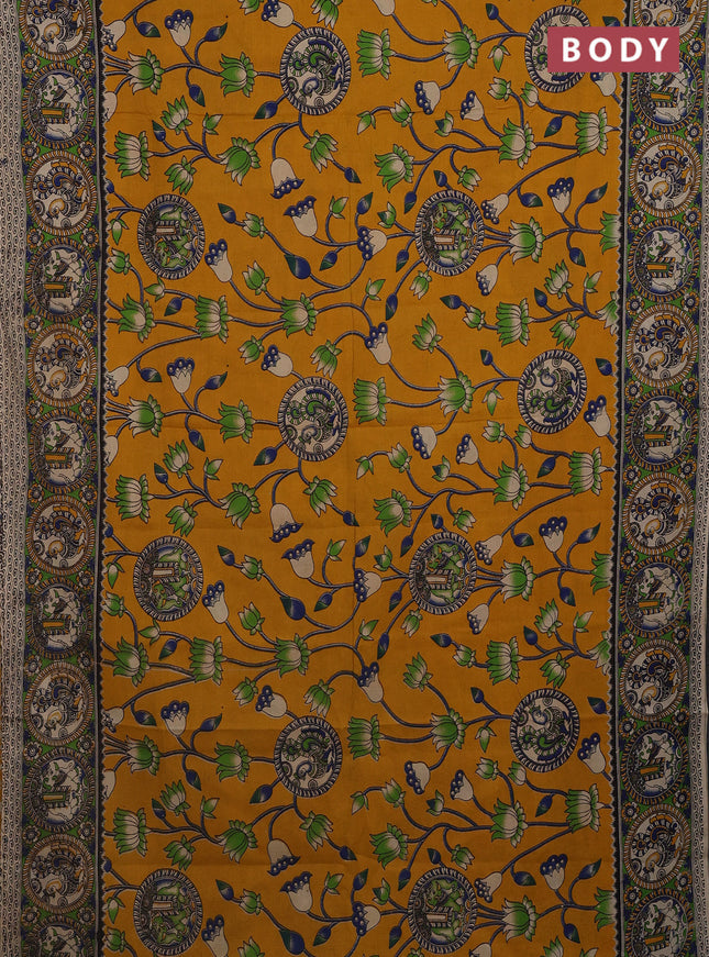 Kalamkari cotton saree mustard yellow and light green with allover prints and printed border
