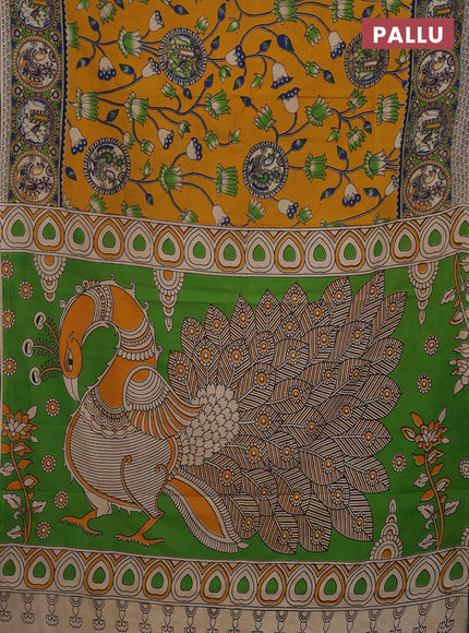 Kalamkari cotton saree mustard yellow and light green with allover prints and printed border