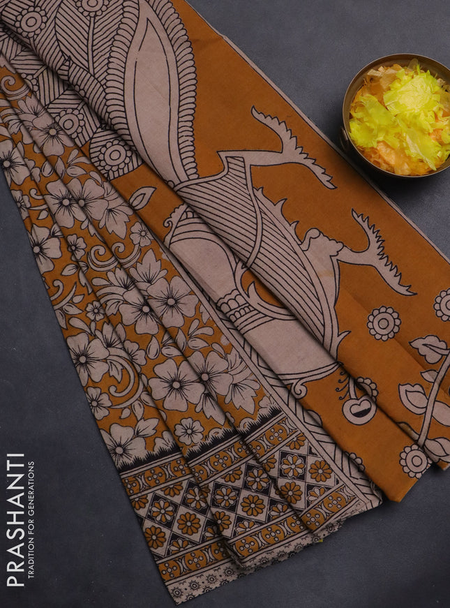 Kalamkari cotton saree dark mustard and beige with allover prints and printed border