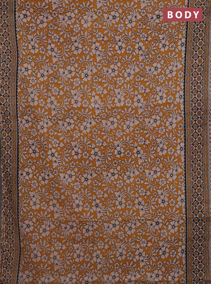 Kalamkari cotton saree dark mustard and beige with allover prints and printed border