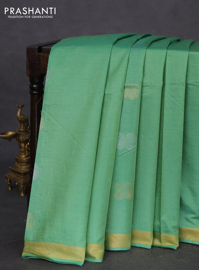 Banana silk saree teal green shade with silver & gold zari woven paisley buttas and zari woven border