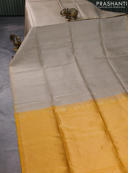Pure soft silk saree beige and yellow with allover zari checks & buttas and simple zari border