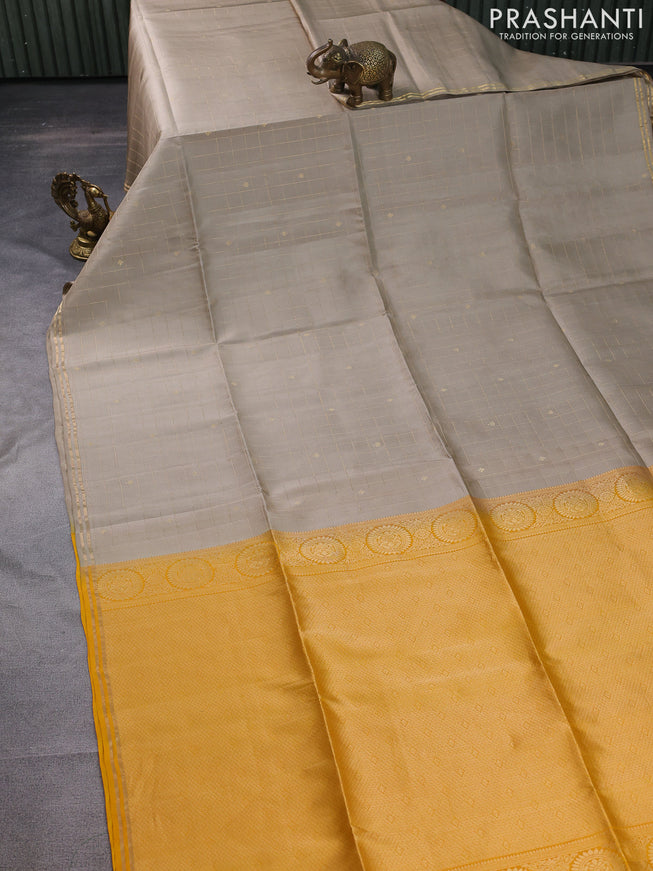 Pure soft silk saree beige and yellow with allover zari checks & buttas and simple zari border