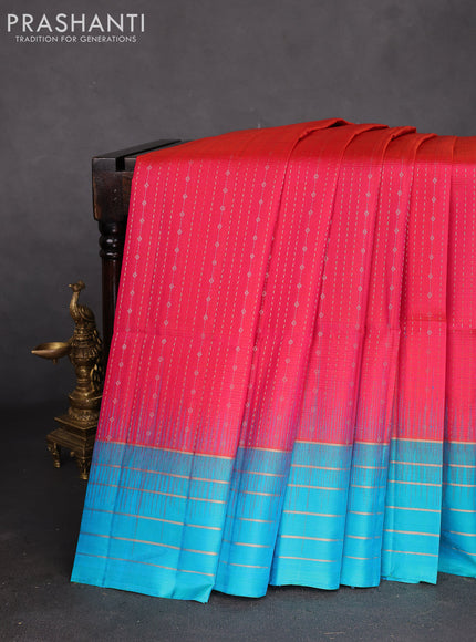 Pure soft silk saree dual shade of pinkish orange and teal blue with allover zari weaves and zari woven simple border