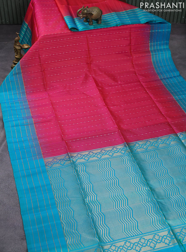 Pure soft silk saree dual shade of pinkish orange and teal blue with allover zari weaves and zari woven simple border