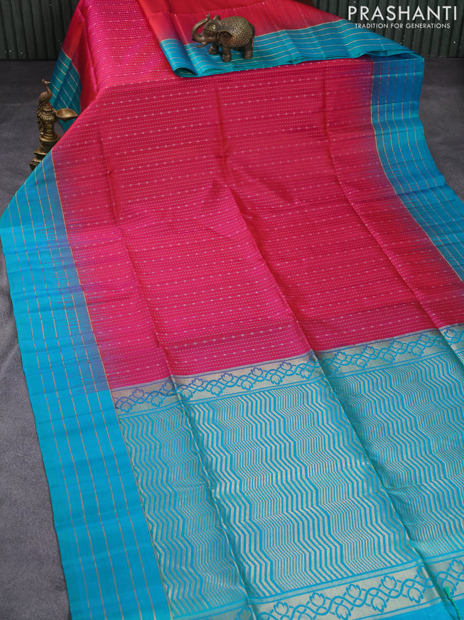 Pure soft silk saree dual shade of pinkish orange and teal blue with allover zari weaves and zari woven simple border