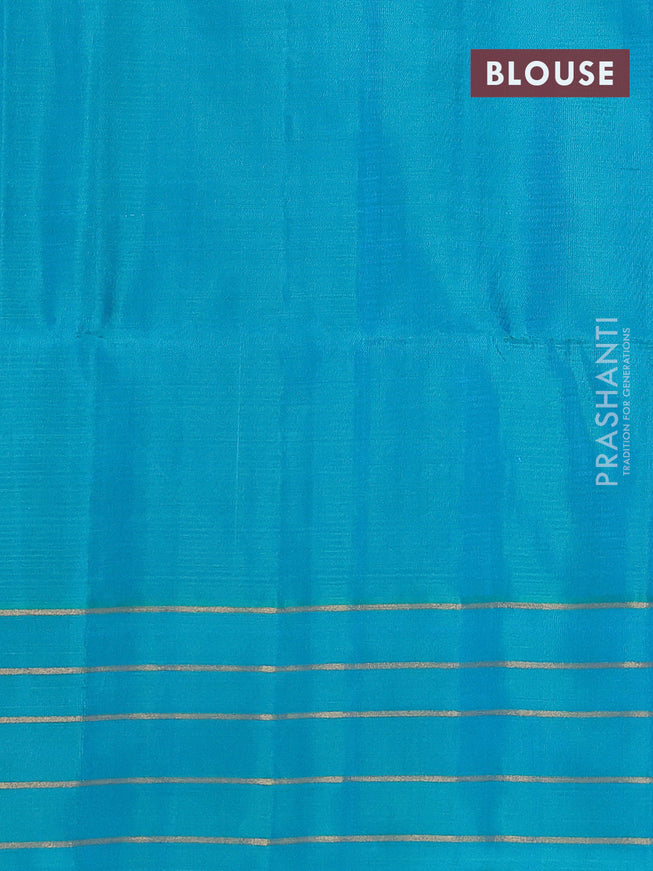 Pure soft silk saree dual shade of pinkish orange and teal blue with allover zari weaves and zari woven simple border