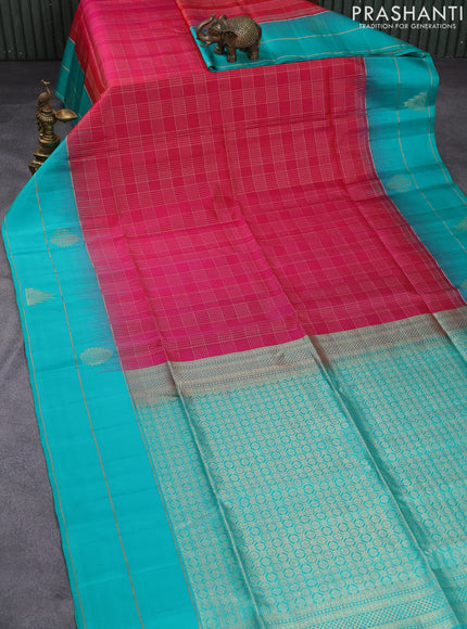 Pure soft silk saree dual shade of pinkish orange and teal blue with allover zari checked pattern and zari woven simple border
