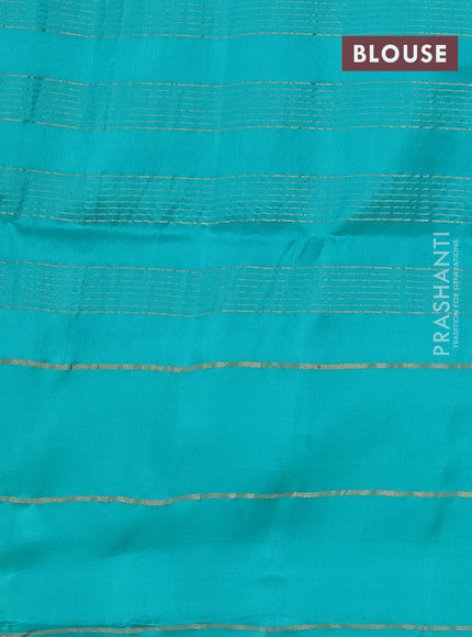 Pure soft silk saree dual shade of pinkish orange and teal blue with allover zari checked pattern and zari woven simple border
