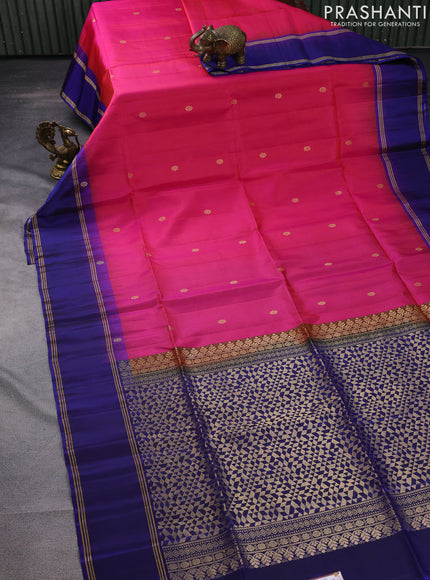 Pure soft silk saree dual shade of pinkish orange and navy blue with zari woven buttas and rettapet zari woven border