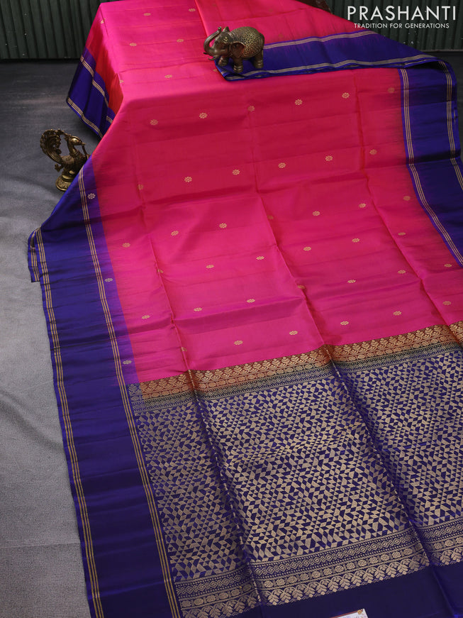 Pure soft silk saree dual shade of pinkish orange and navy blue with zari woven buttas and rettapet zari woven border