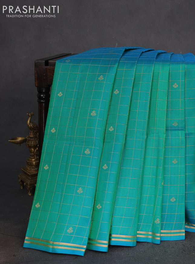 Pure soft silk saree dual shade of teal green and dual shade of pinkish orange with allover small zari checks & buttas and simple zari border