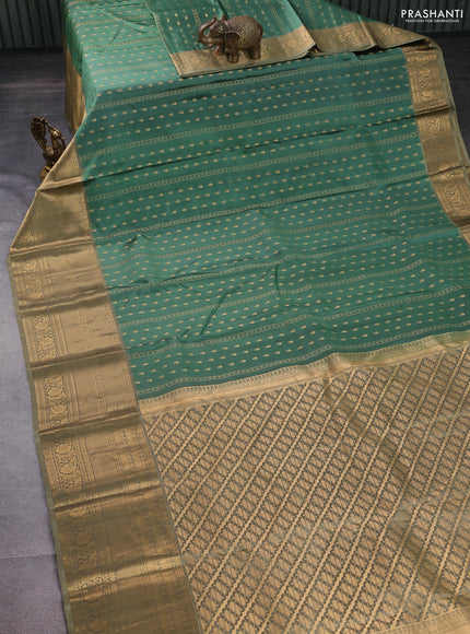 Pure kanchipuram silk saree pastel green and beige with allover zari weaves & buttas and long rich zari woven border