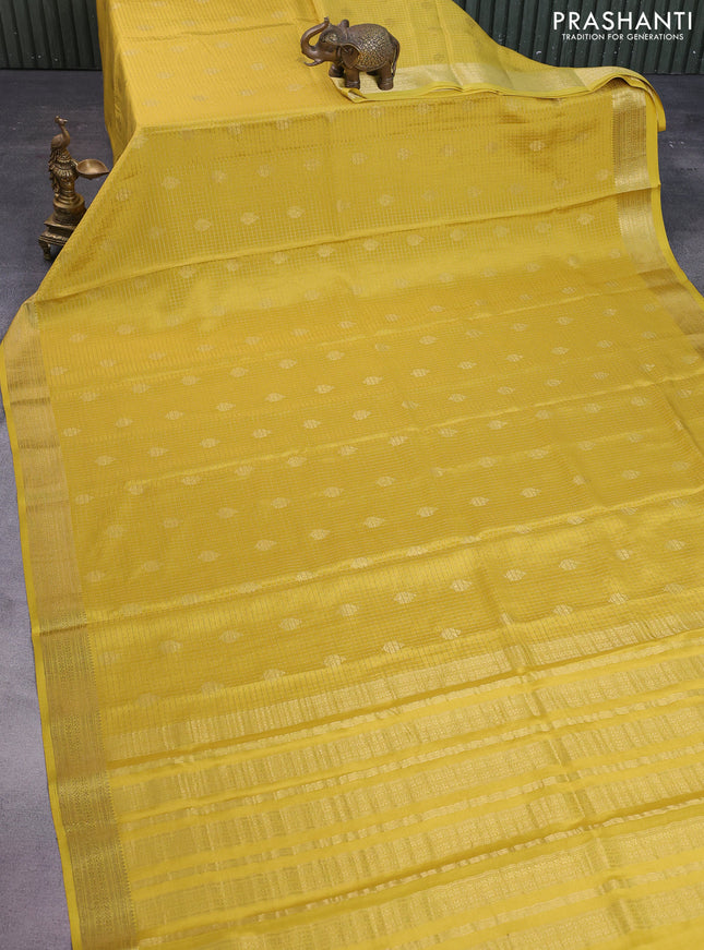 Pure mysore silk saree pale yellow with allover small zari checks & buttas and zari woven border