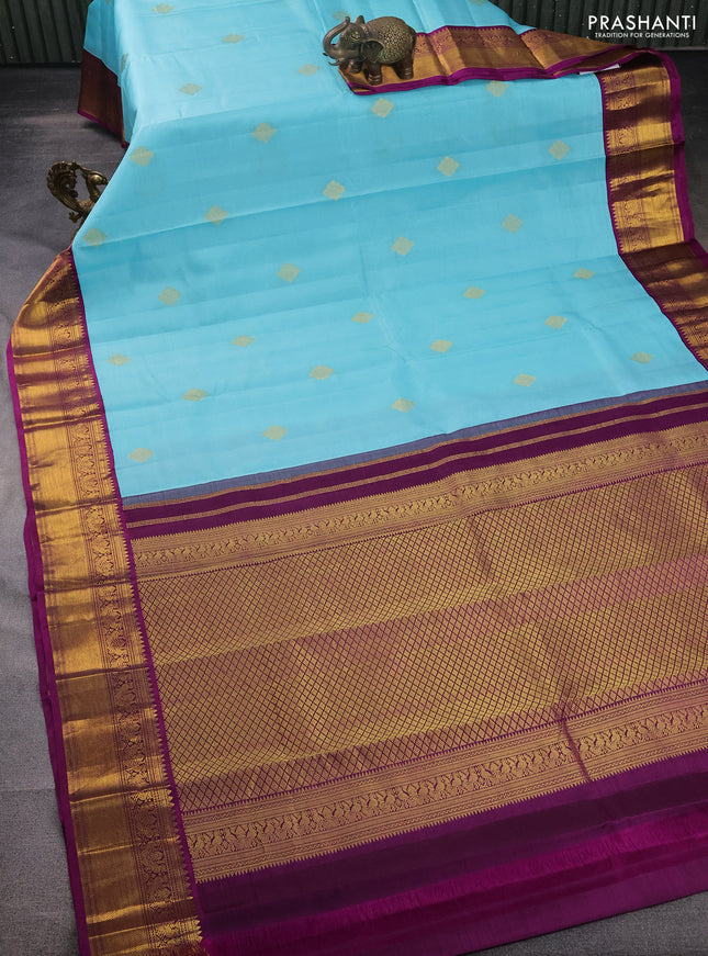 Pure kanchipuram silk saree light blue and purple with zari woven buttas and zari woven korvai border