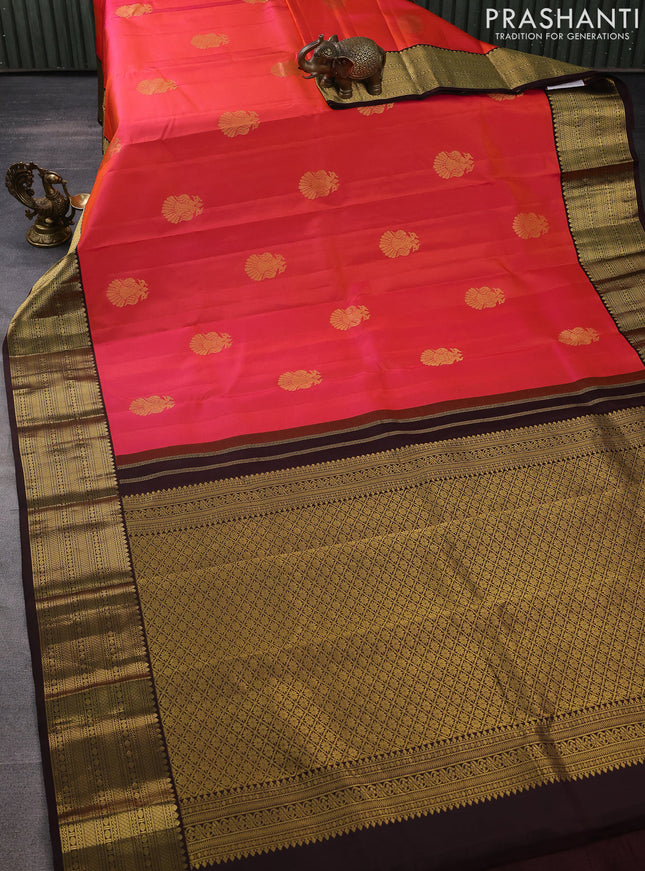 Pure kanchipuram silk saree dual shade of pinkish orange and brown with peacock zari woven buttas and zari woven korvai border