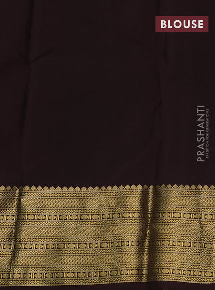 Pure kanchipuram silk saree dual shade of pinkish orange and brown with peacock zari woven buttas and zari woven korvai border