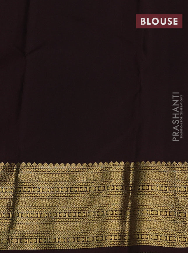 Pure kanchipuram silk saree dual shade of pinkish orange and brown with peacock zari woven buttas and zari woven korvai border