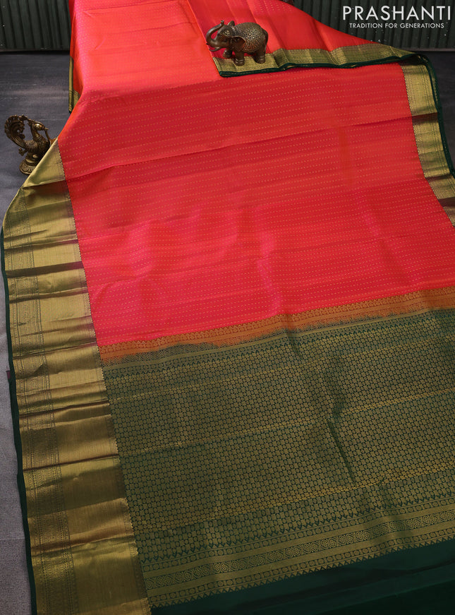 Pure kanchipuram silk saree dual shade of pinkish orange and green with allover zari woven 1000 buttas and zari woven border