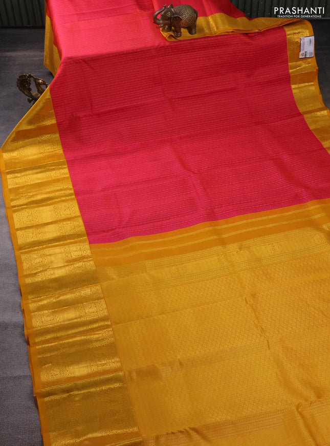 Pure kanchipuram silk saree pink and mustard yellow with allover zari weaves and zari woven korvai border