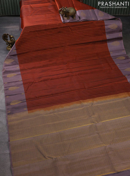 Pure kanchipuram silk saree rust shade with allover zari weaves and zari woven butta border