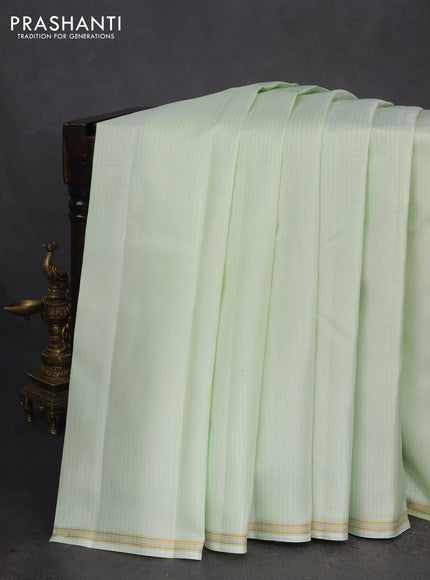 Pure kanchipuram silk saree pista green and dark green with allover stripes pattern and zari woven simple border