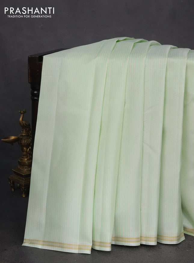 Pure kanchipuram silk saree pista green and dark green with allover stripes pattern and zari woven simple border