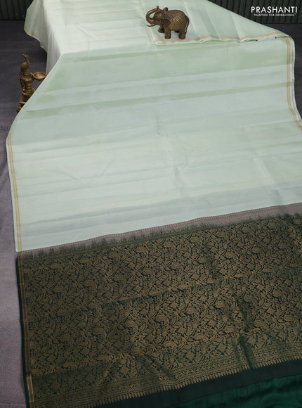 Pure kanchipuram silk saree pista green and dark green with allover stripes pattern and zari woven simple border