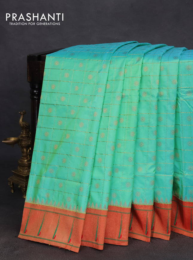 Pure paithani silk saree dual shade of teal blue and red with allover zari checks & buttas and zari woven muniya butta border
