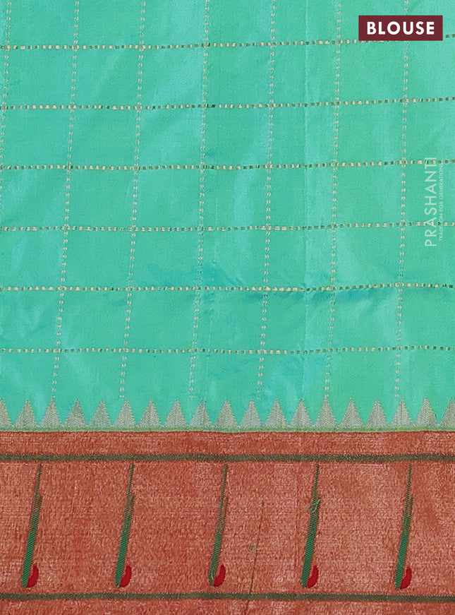 Pure paithani silk saree dual shade of teal blue and red with allover zari checks & buttas and zari woven muniya butta border