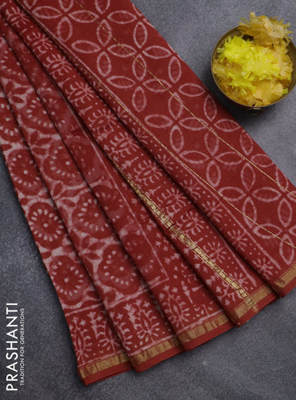 Chanderi bagru saree rustic orange and off white with allover dabu prints and small zari woven border